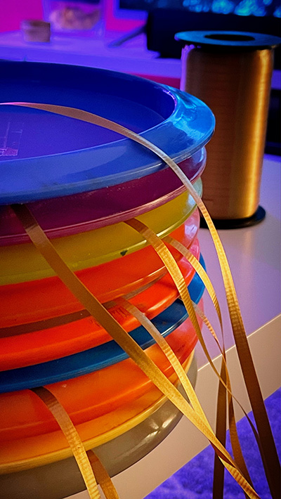 Disc golf discs with ribbons attached for winter play
