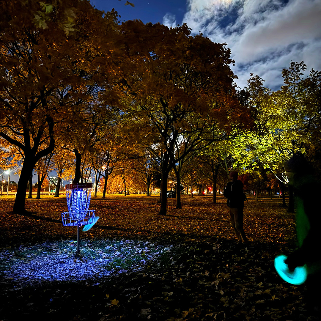 Beginner-friendly glow-in-the-dark disc golf played at night using glowing discs and lit baskets, requiring minimal equipment and welcoming players of all skill levels.