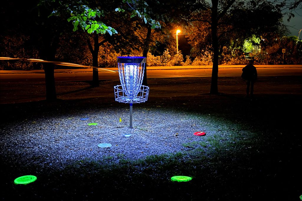 Beginner-friendly glow-in-the-dark disc golf played at night using glowing discs and lit baskets, requiring minimal equipment and welcoming players of all skill levels.